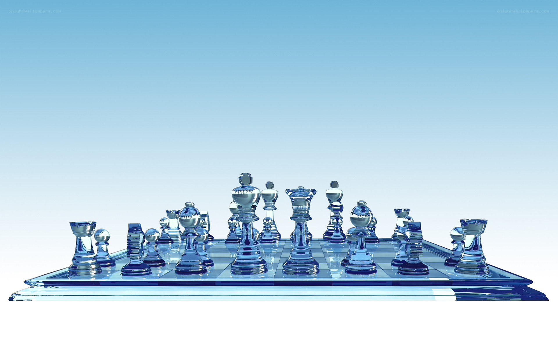 glass chess set on blue board