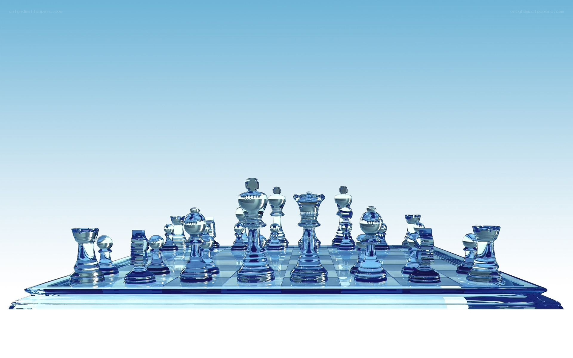 Glass chess set on blue board
