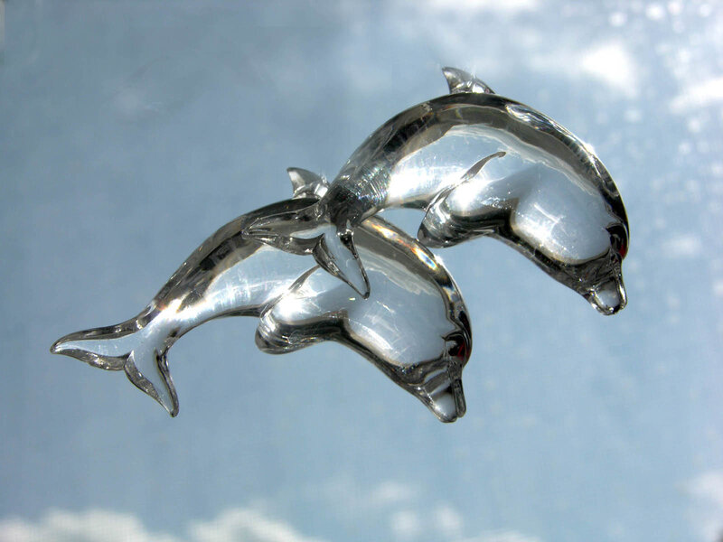 Glass dolphin figurines