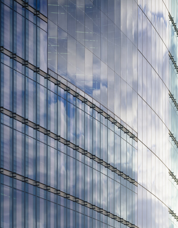 glass facade with sky reflection