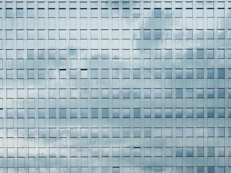 glass facade with sky reflection