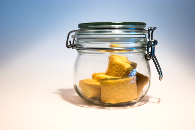 glass jar with yellow cubes