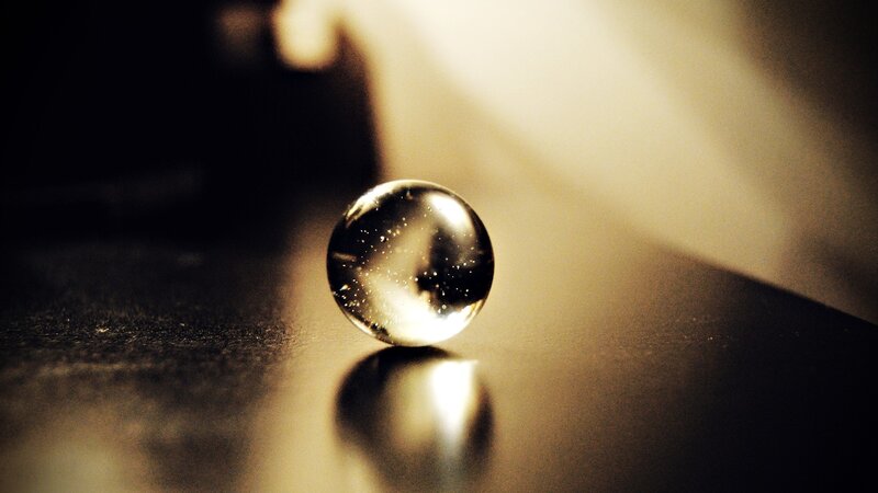 glass marble on dark surface