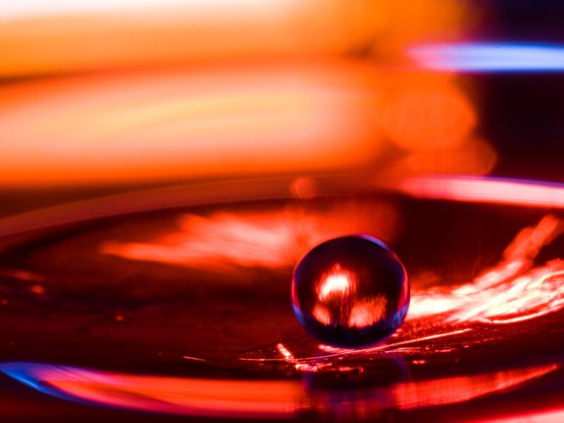 Glass Marble on Surface — Red