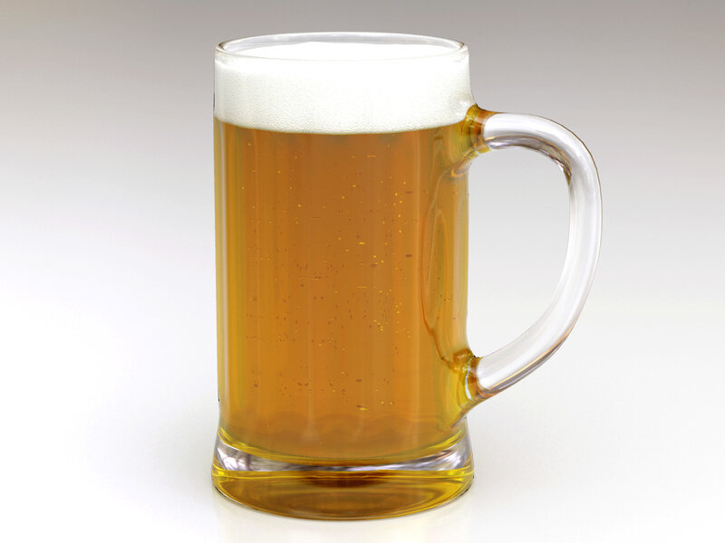 Glass mug of beer with foam