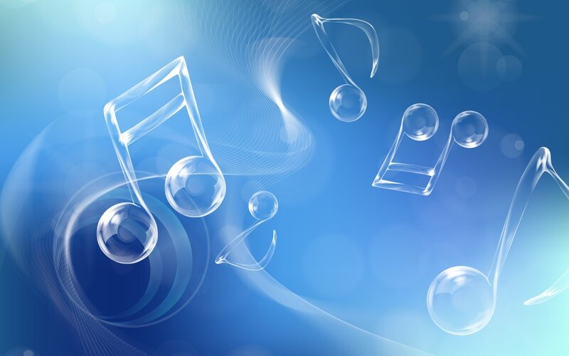 Glass music notes on blue