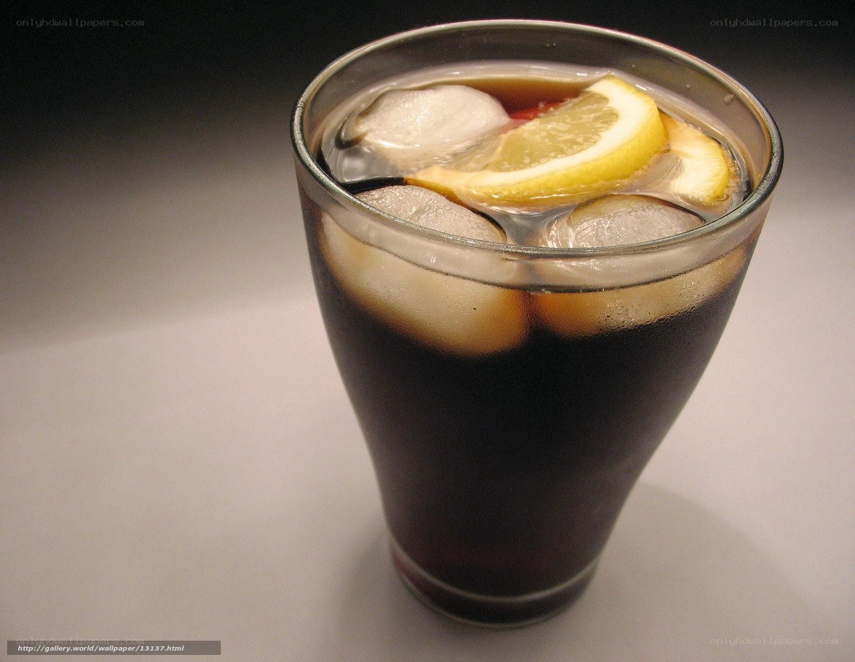 glass of cola with lemon and ice