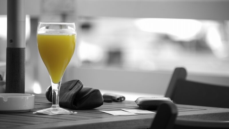 Glass of orange juice on a table
