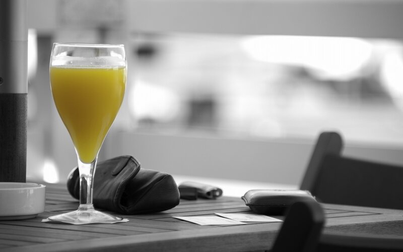 glass of orange juice on table
