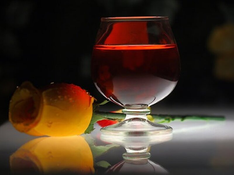 Glass of Red Liquid — Dramatic