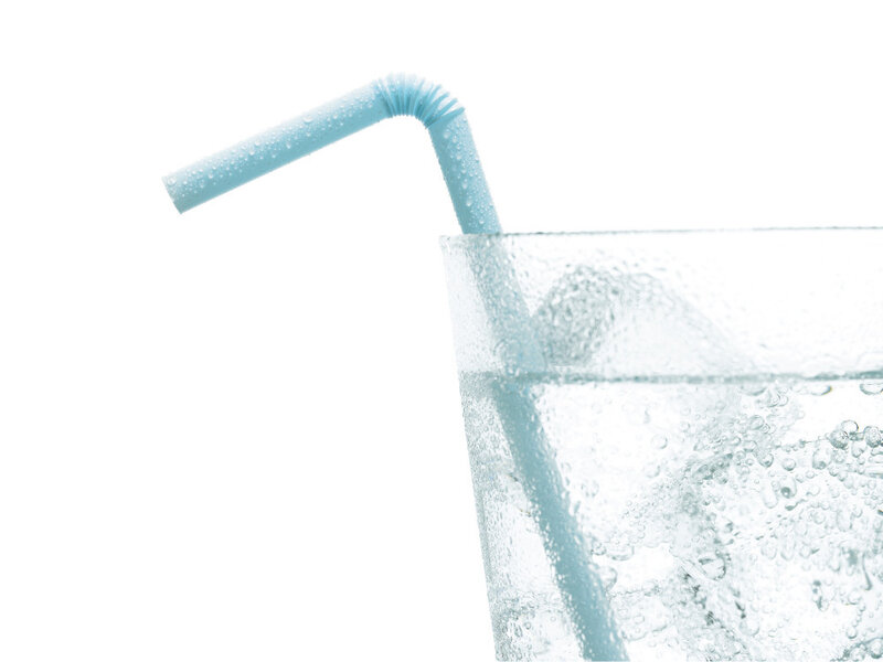 glass of sparkling water with straw