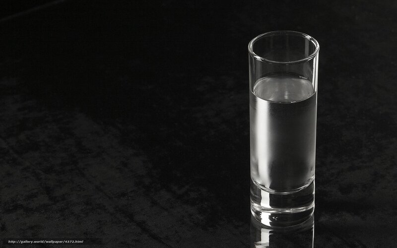 glass of water on black surface