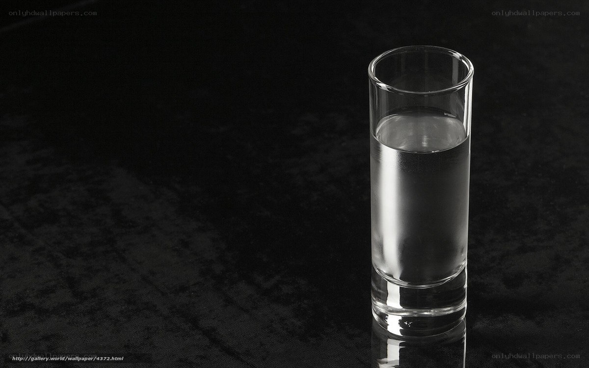 glass of water on black surface