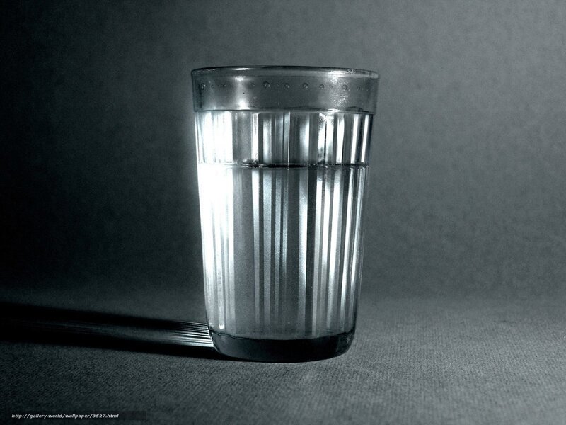 glass of water on dark surface