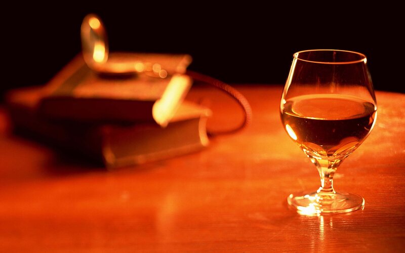 glass of whiskey on a table