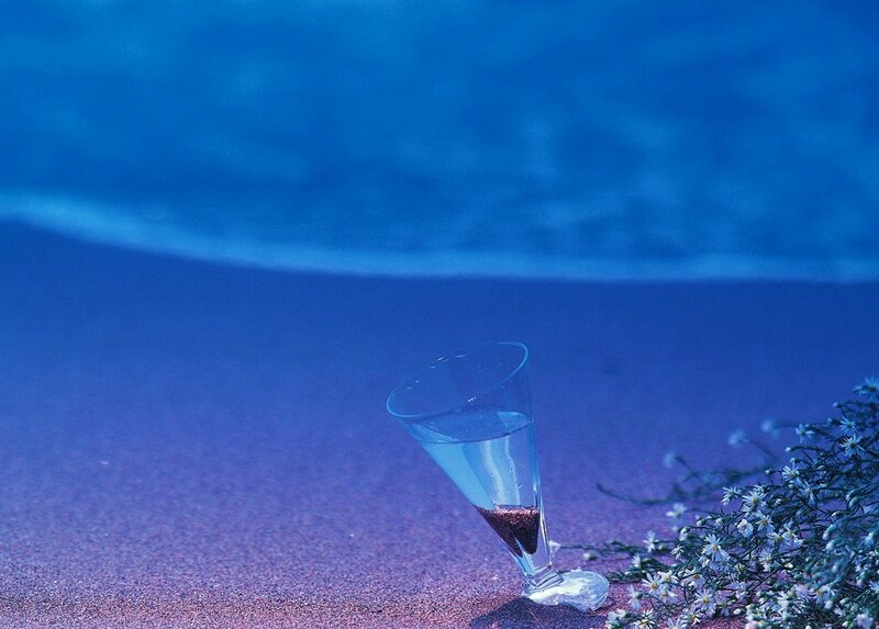glass on a blue beach