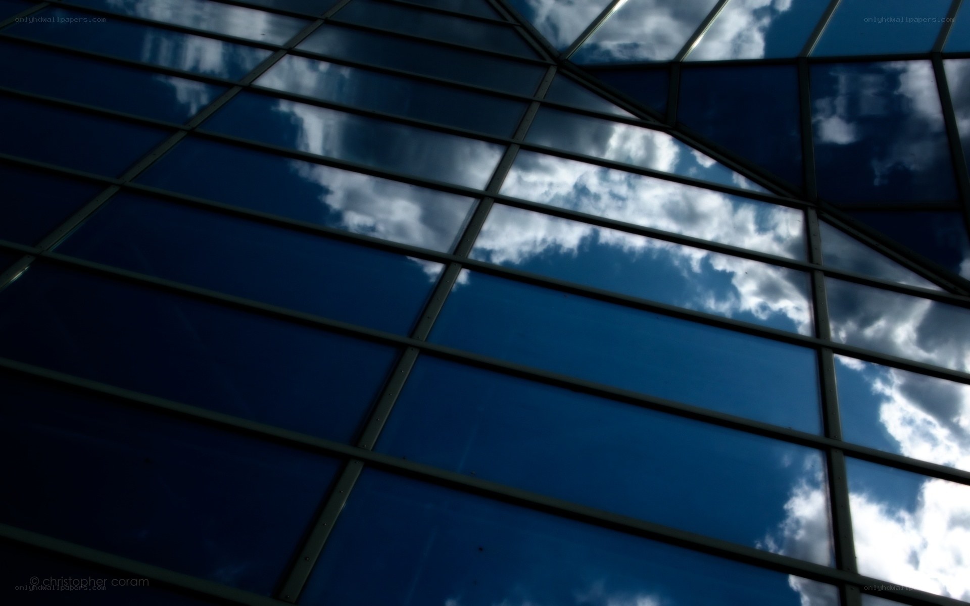 Glass panels reflecting sky