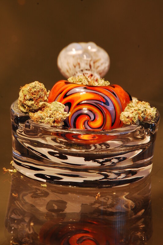 Glass pipe with cannabis buds
