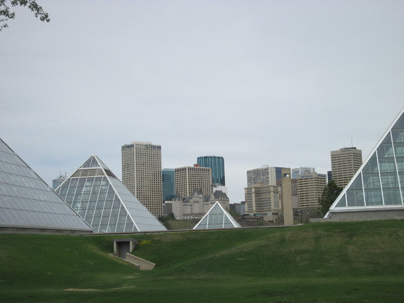 Glass Pyramids and City Skyline