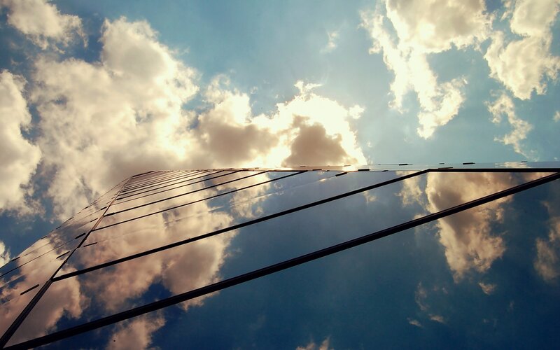 Glass Skyscraper Facade — Blue, Dramatic, Afternoon, Photograph, Clouds