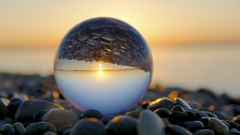 Glass Sphere on Pebbles — Blue