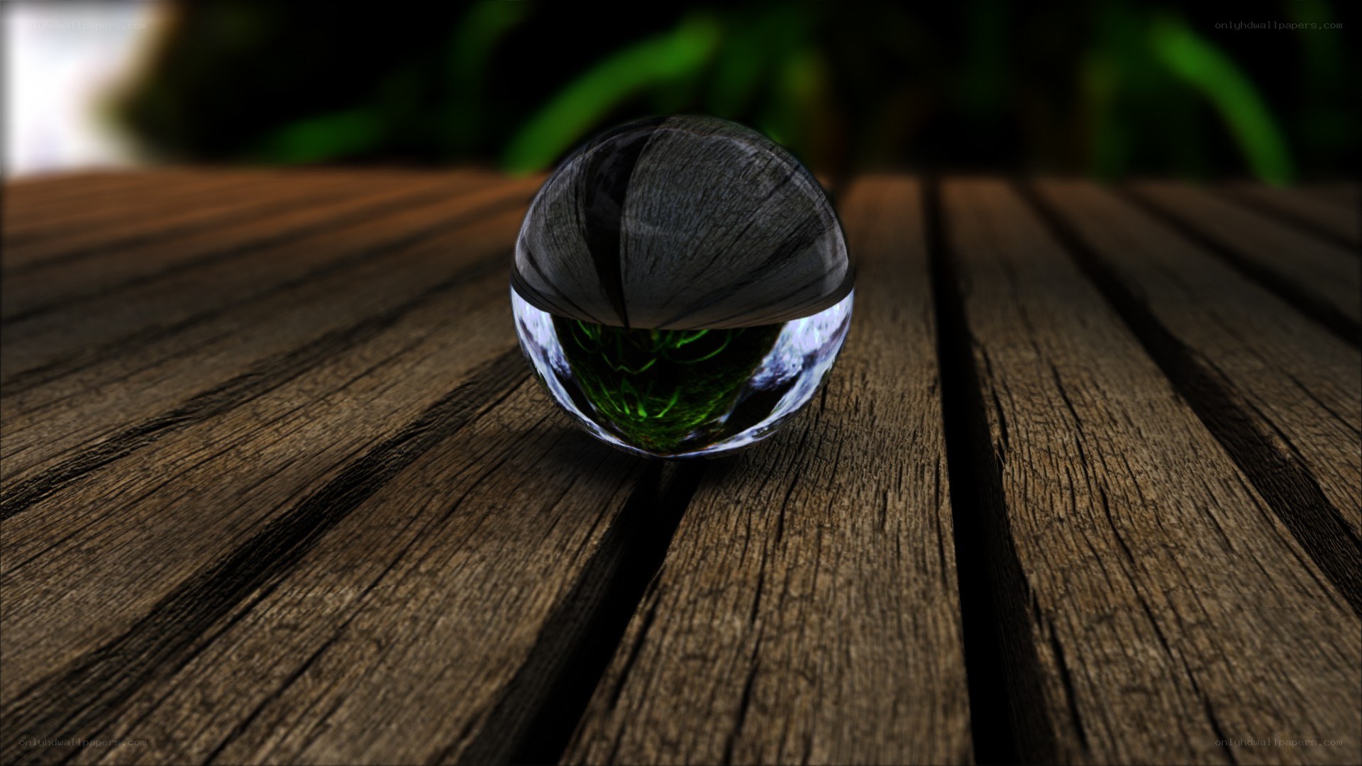 glass sphere on wooden surface