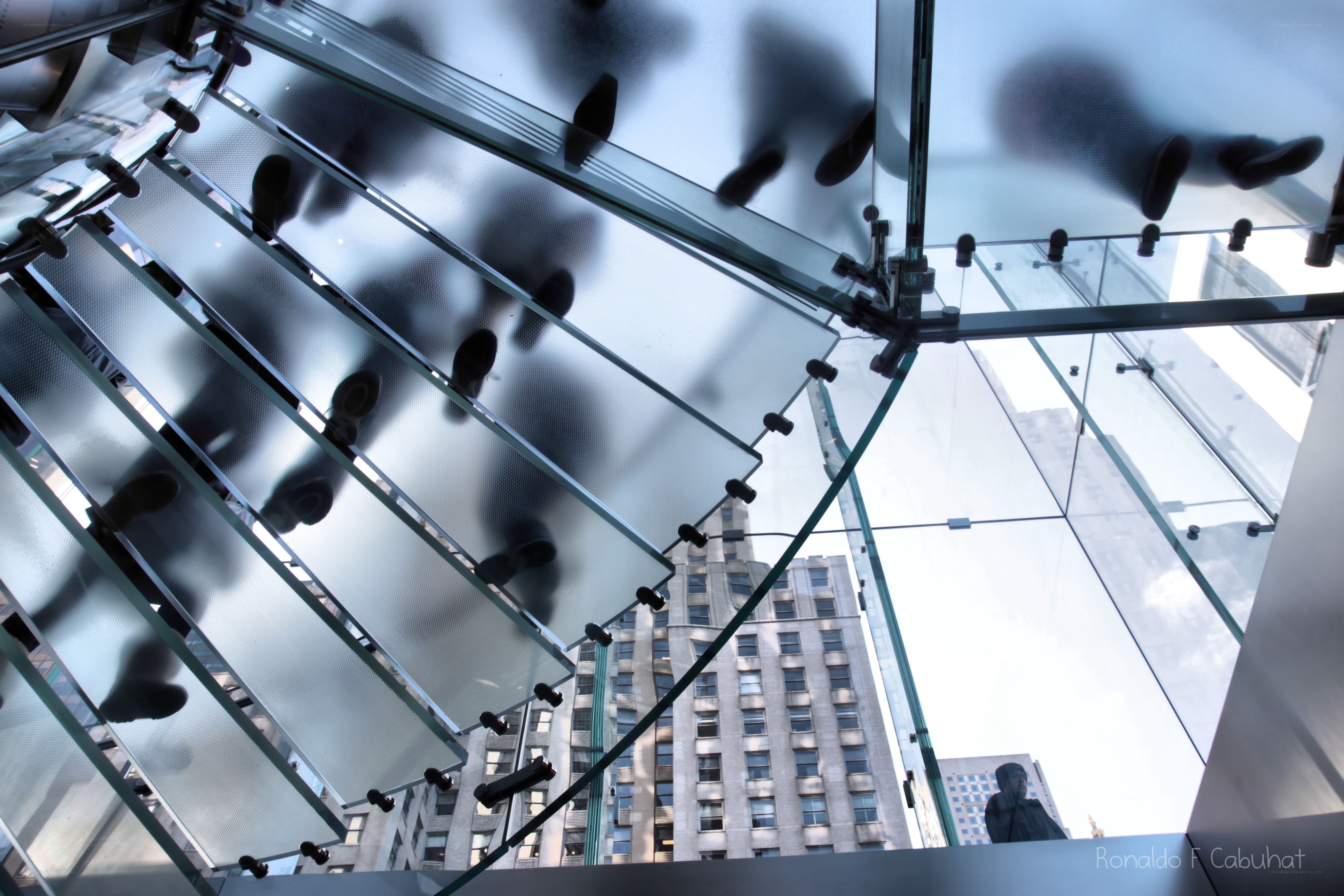 Glass staircase with city view