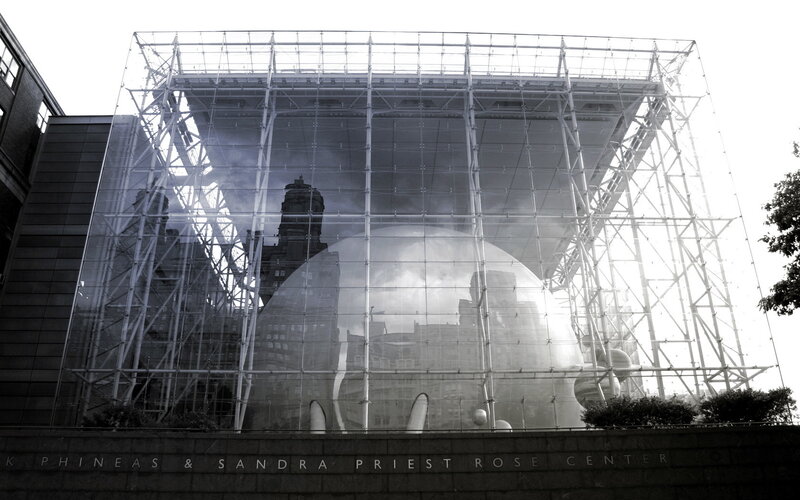 Glass structure with city reflection