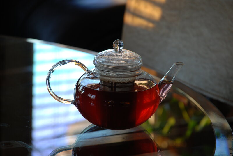 Glass teapot with tea