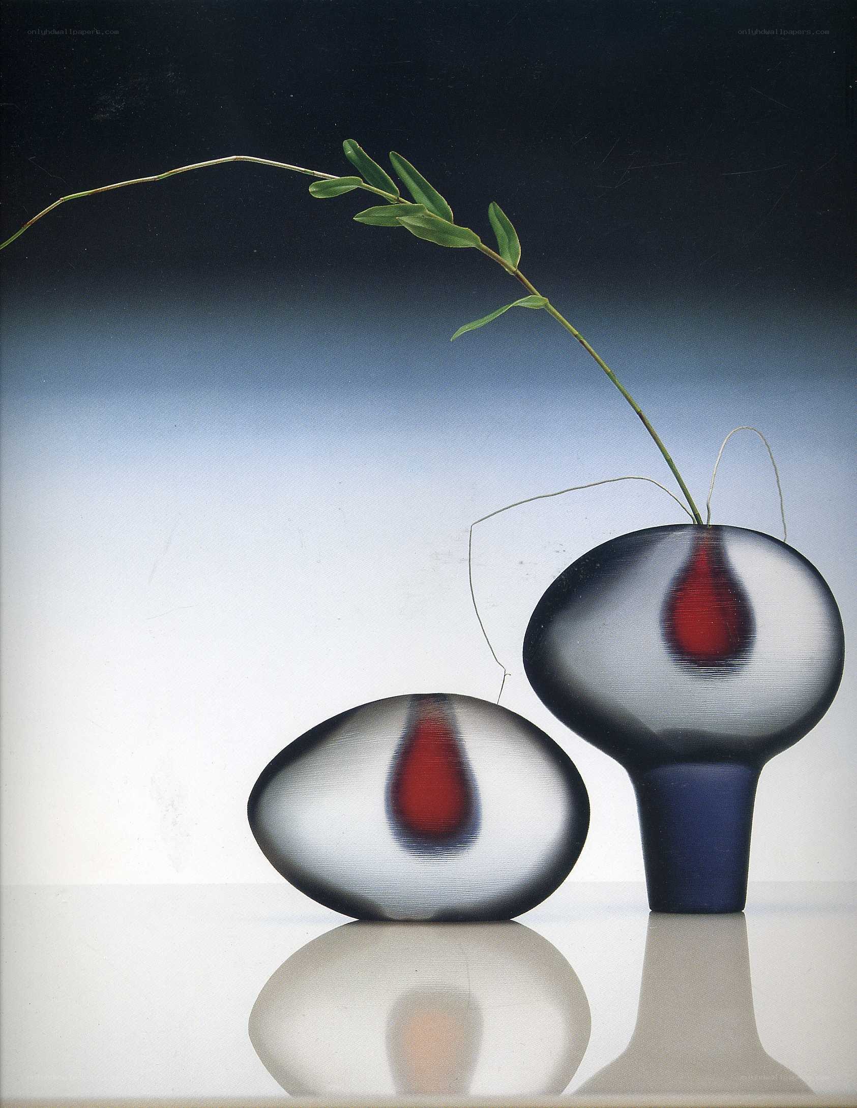 Glass vases with red drops