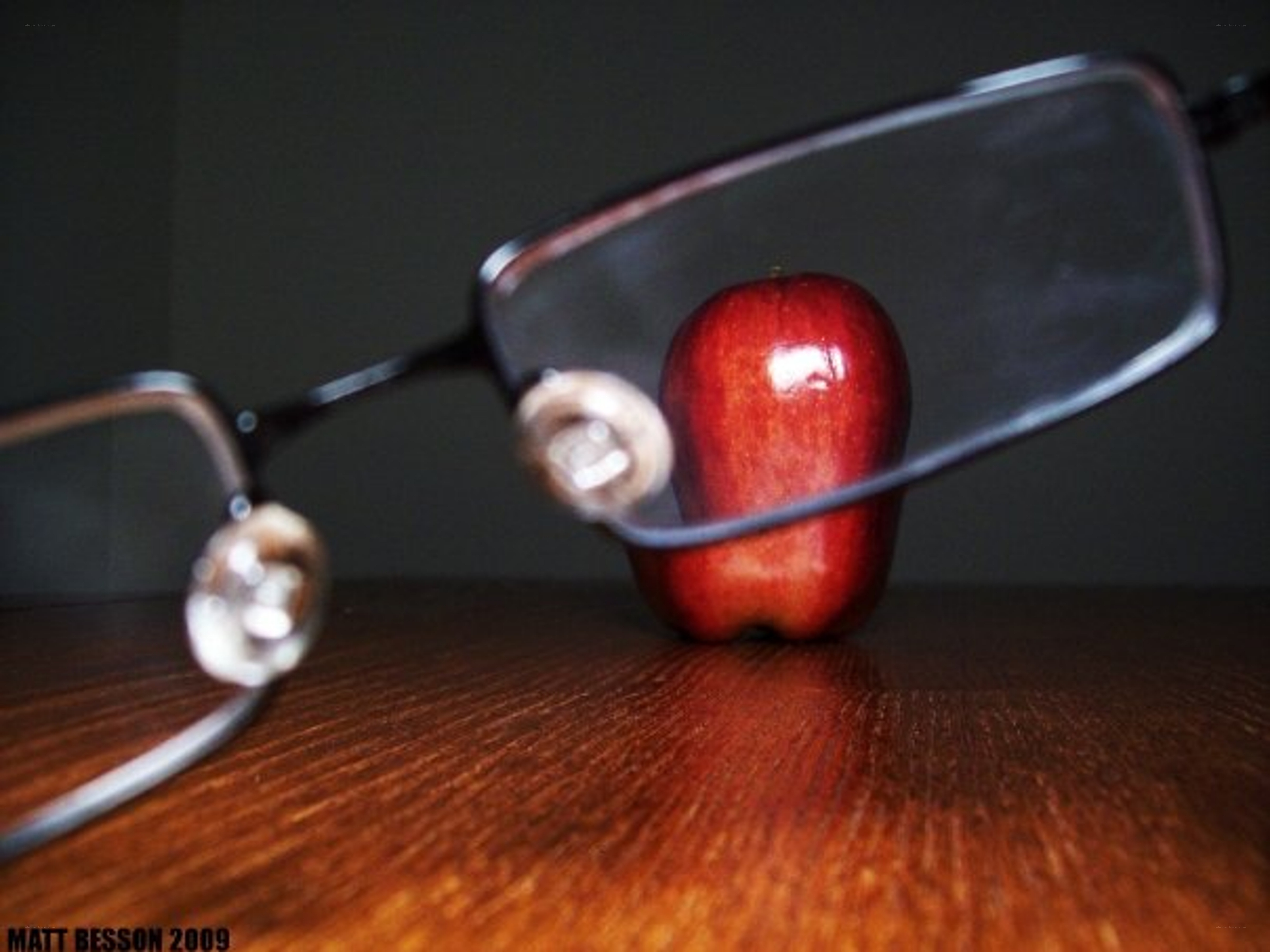 glasses and apple on table