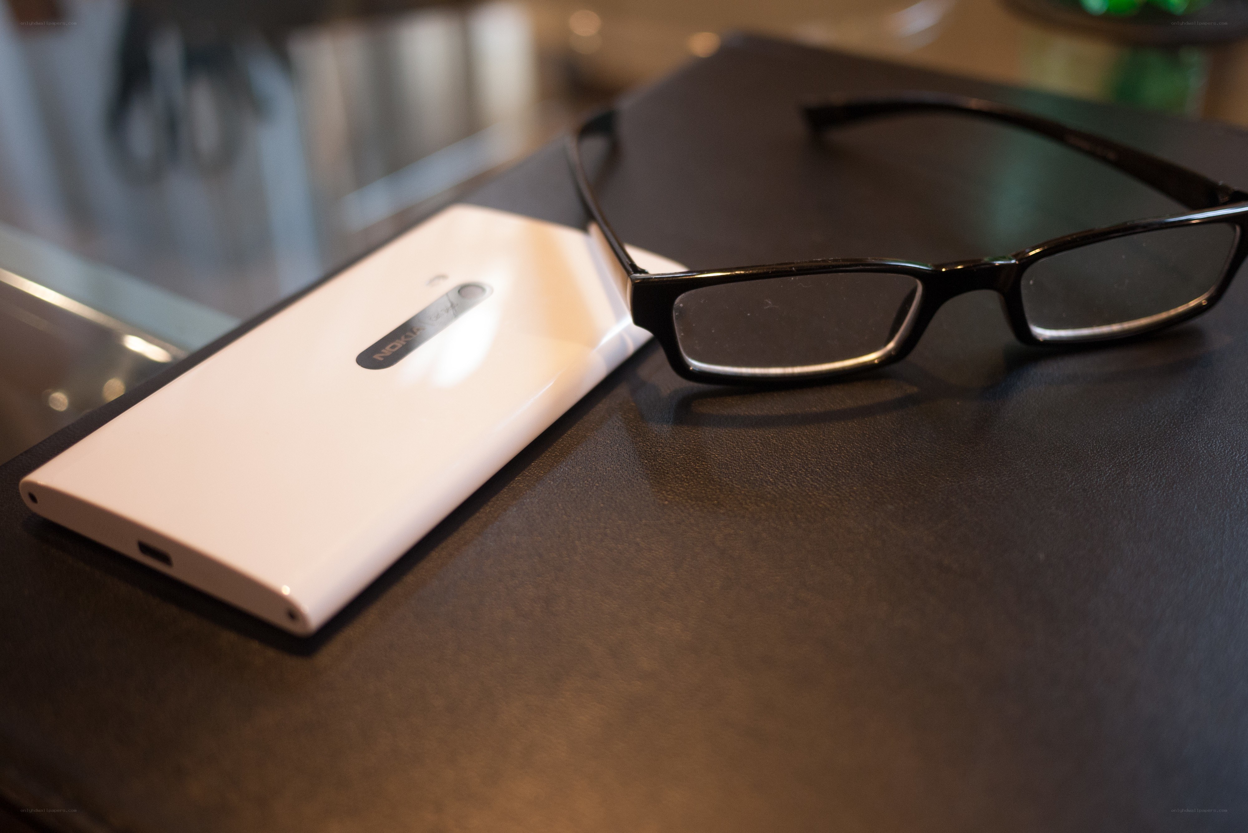 glasses and phone on table