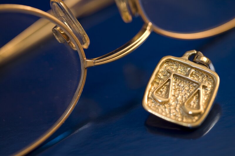 glasses and scales pendant