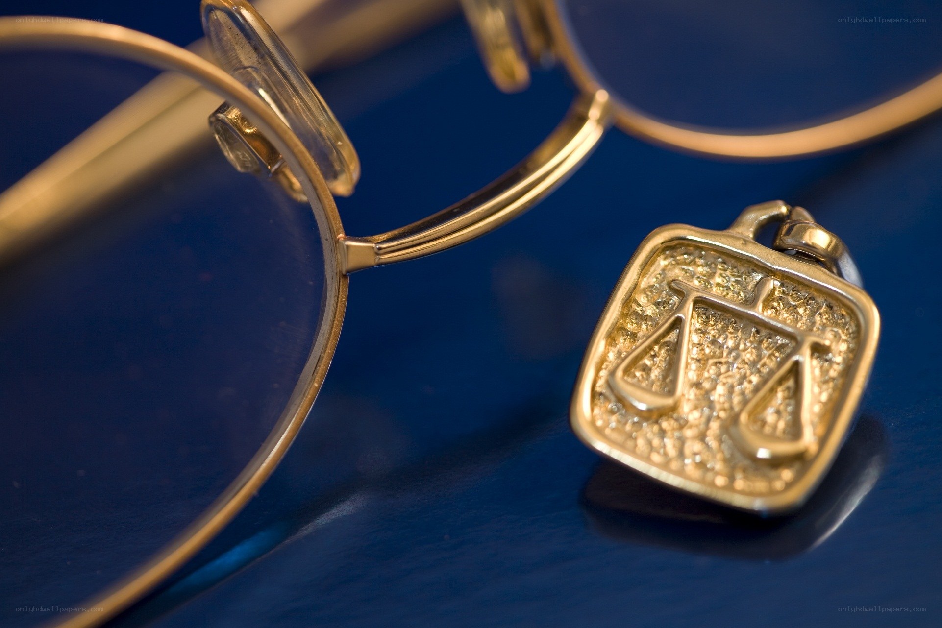 glasses and scales pendant