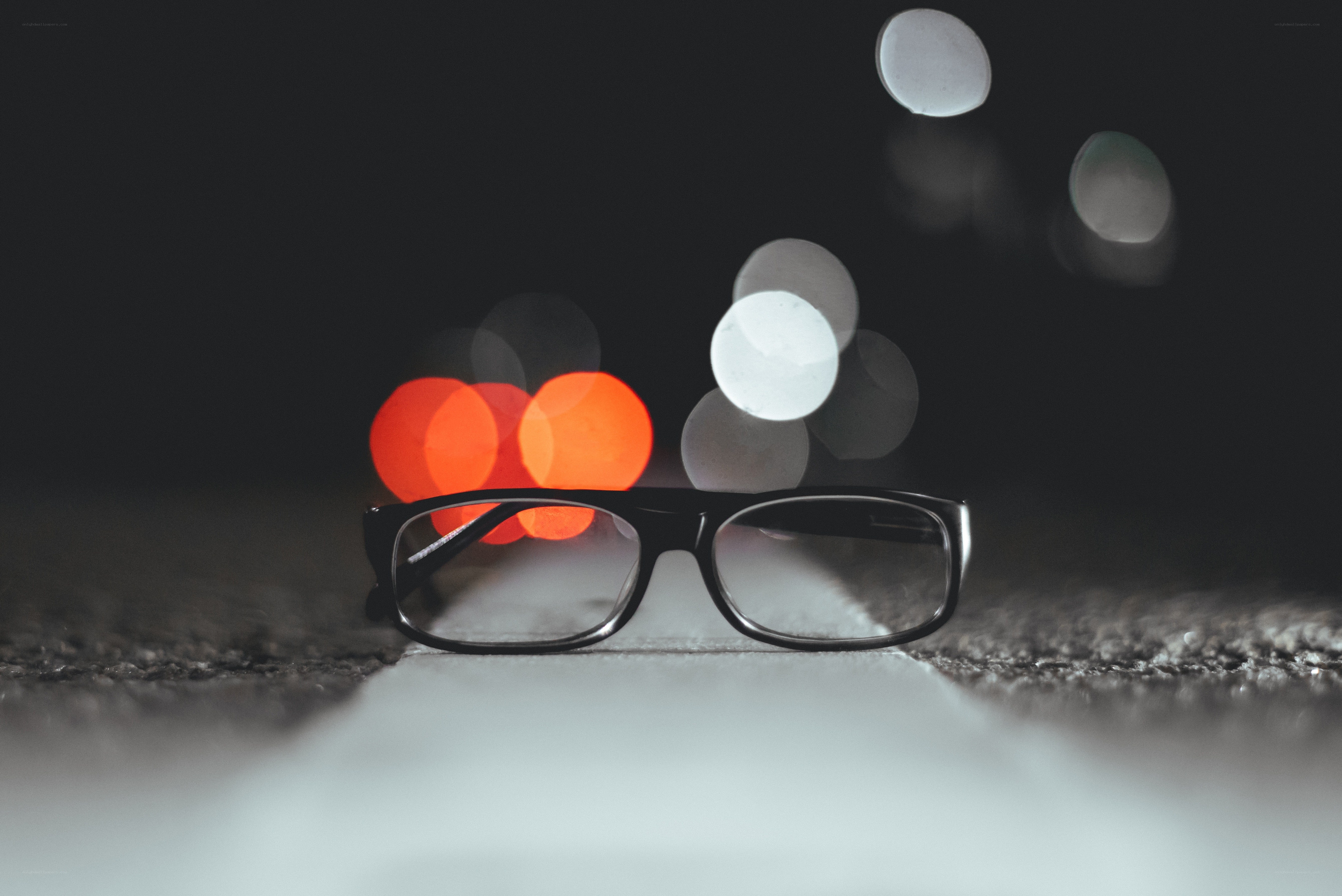 glasses on a road at night