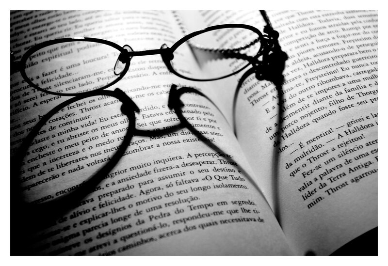 glasses on open book