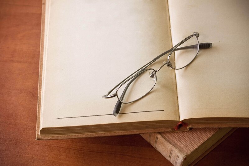 glasses on open book