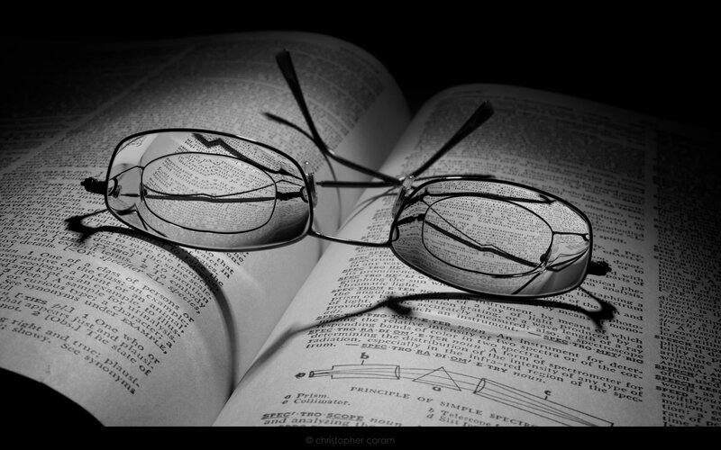 glasses on open book
