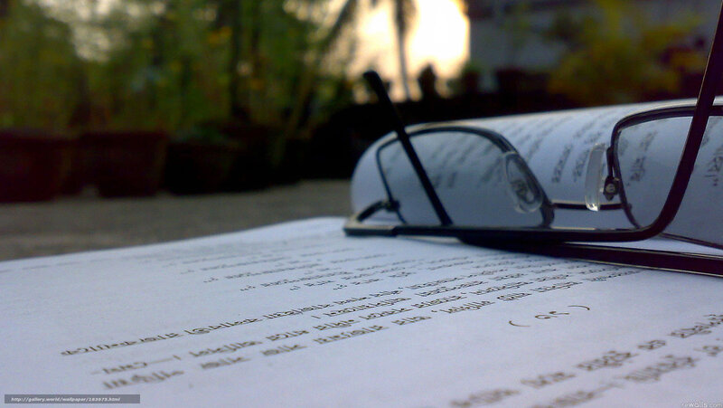 glasses on open book