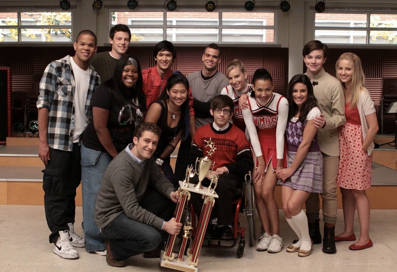 Glee cast with trophies