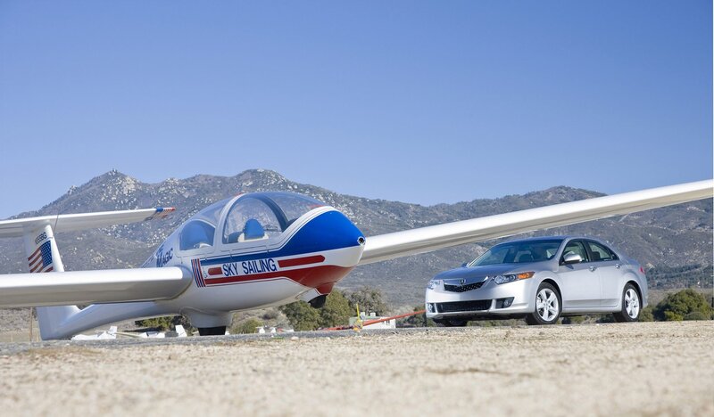 Glider and car on airfield
