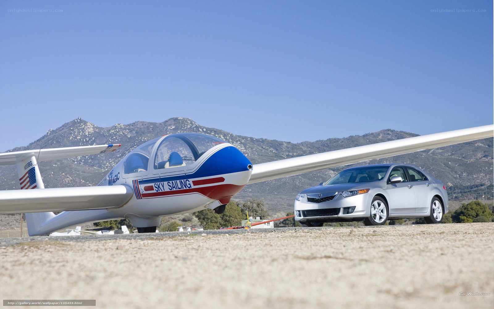 Glider and car on airfield