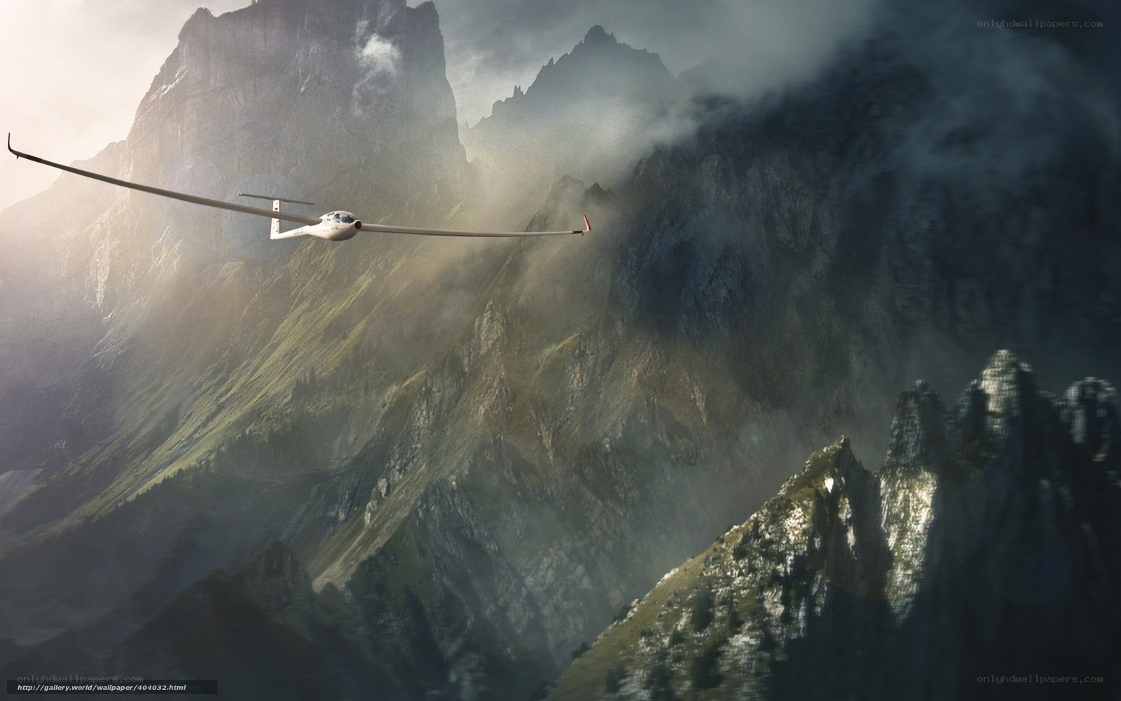 glider flying over mountains