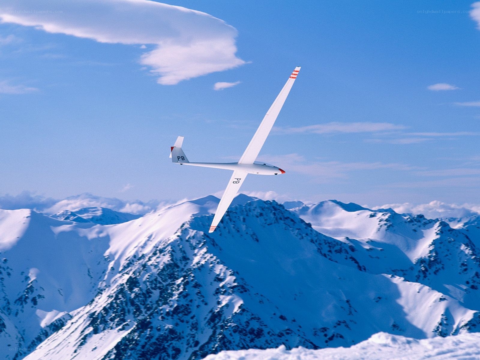 Glider over snowy mountains