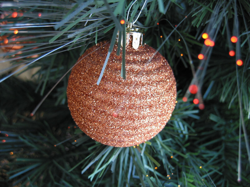 glittery ornament on tree
