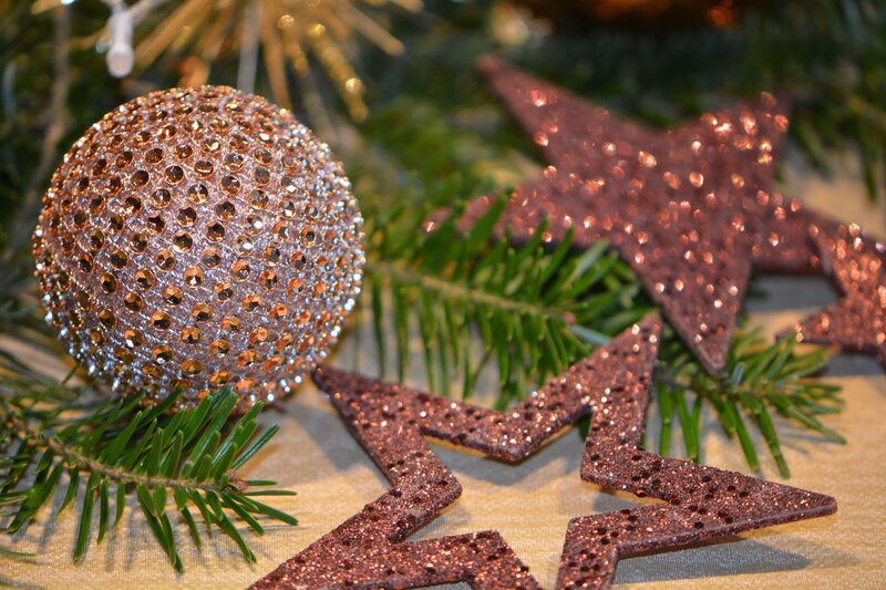 glittery ornaments on pine