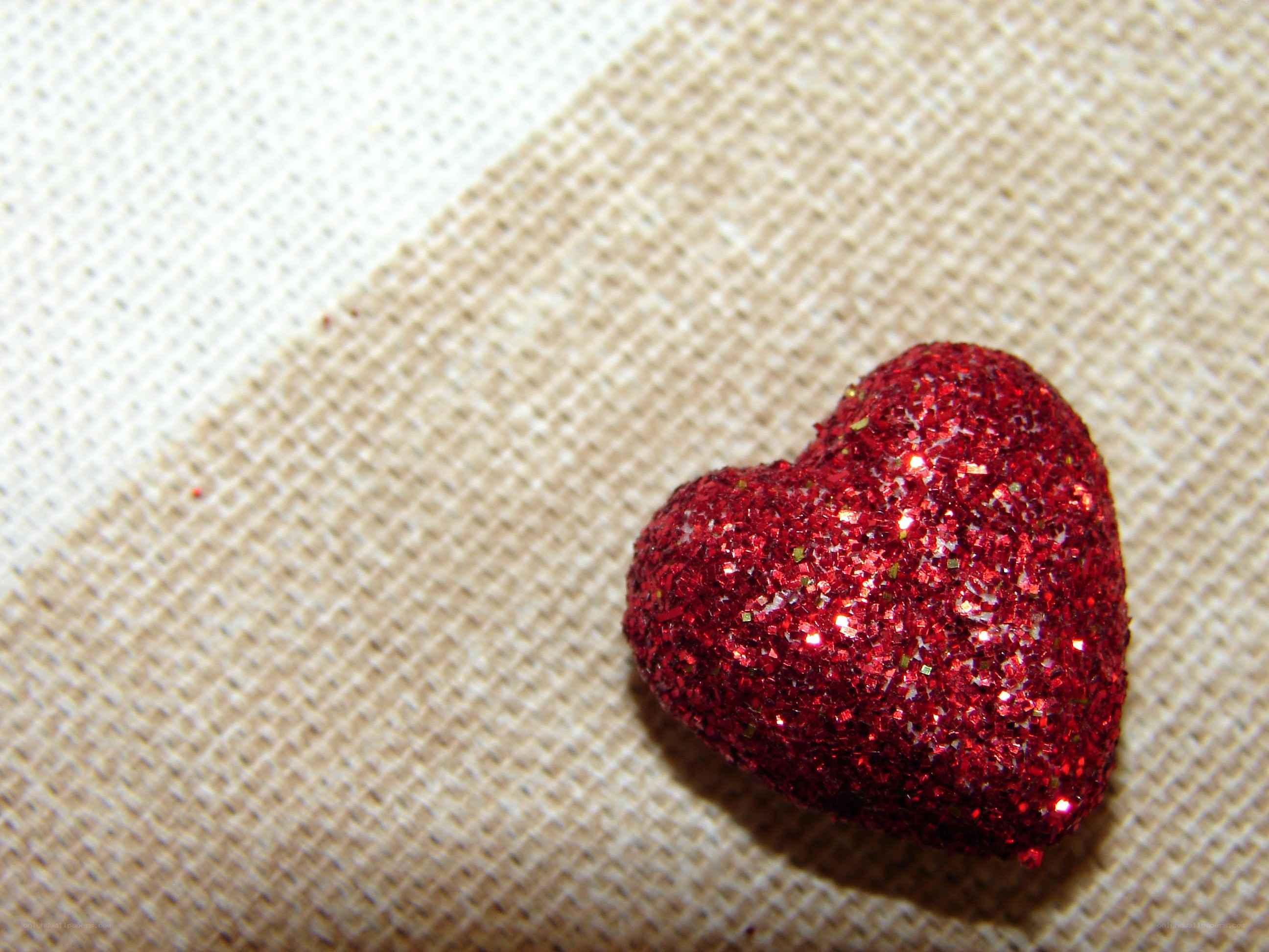 glittery red heart on fabric