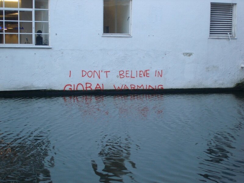Global warming graffiti on flooded wall