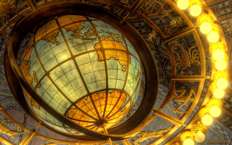 Globe chandelier in ornate hall