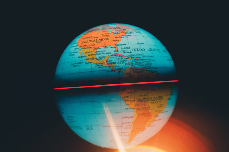 Globe with red light beam